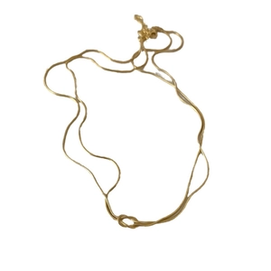 Handmade gold plated stainless steel snake chain necklace with a centered knot design