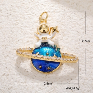 Close-up of astronaut pendant with blue opal planet and golden star detail