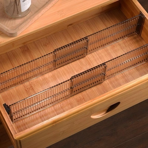 Adjustable transparent plastic drawer dividers for organizing clothes in wooden drawers