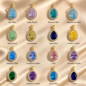 Vue détaillée de pendentifs en zircon coloré en forme de poire avec de petits accents blancs
