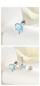 Detail of light blue heart-shaped zircon earring with silver metal and screw back design