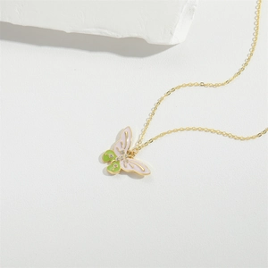 Exquisite gold butterfly pendant necklace with pink and green enamel on stone background