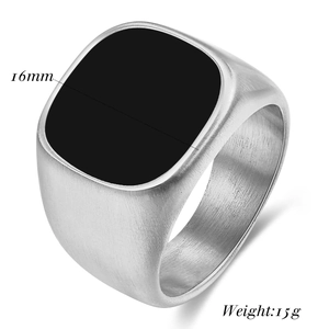 Detailed view of a 16mm matte signet ring with black enamel and brushed metal texture