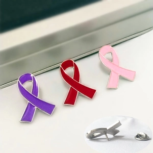 Detailed view of red ribbon lapel pins with clutch back design for HIV awareness support