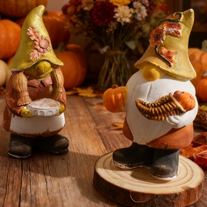 Close-up of DIY harvest gnome silicone mold figures with pumpkin and flower details