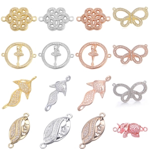 Assorted gold and silver zircon charms including butterfly, elephant, and ballet dancer
