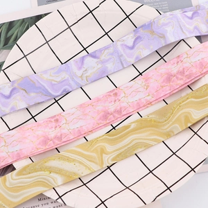 Detailed close-up of marble texture lanyards in purple, pink, and yellow colors
