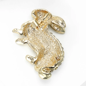 Detailed back view of a golden metal rabbit brooch showing the pin clasp mechanism