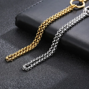 Macro view of dual-tone gold and silver stainless steel chain link bracelet details