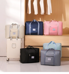 Foldable large capacity travel bags in six colors showing the trolley sleeve functionality