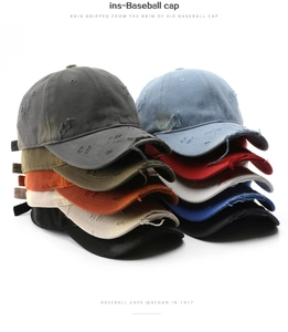 Detail of distressed vintage baseball caps with frayed edges and washed cotton texture