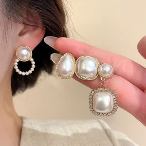 Elegant gold earrings set featuring pearls and rhinestones in vintage square design