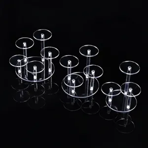 Three-tier clear acrylic round jewelry display stands set on a reflective black base