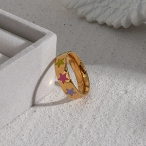 18K gold plated stainless steel ring with colorful enamel stars on white jewelry box