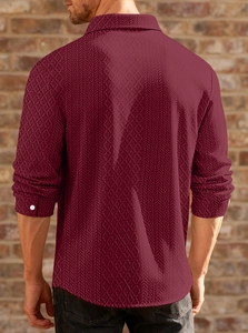 Detail of maroon long sleeve shirt showing 3D geometric jacquard texture and premium fabric