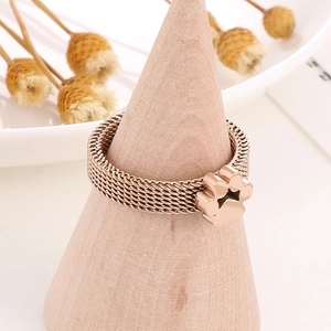 Detail of rose gold stainless steel mesh ring featuring a hollow star cat paw pendant
