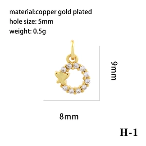 Macro detail of 18K gold plated copper butterfly pendant with zircon ring and 5mm hole