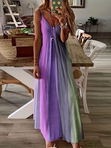 Detail of bohemian V-neck maxi dress with purple and green vertical gradient stripes