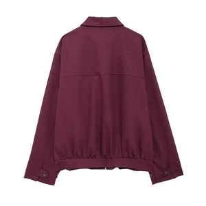 Detailed back view of a burgundy zipper jacket with classic lapel and ribbed hemline