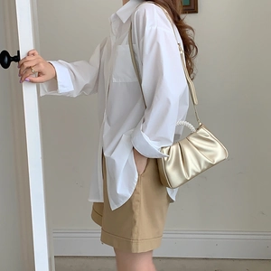 Golden pleated cloud handbag with pearl handle and metallic leather texture for women