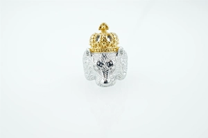 Macro view of punk lion head ring with golden crown and silver finish detailing
