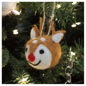 Handmade wool felt reindeer ornament hanging on Christmas tree with warm lights