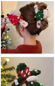Detailed view of plush Christmas hair accessories featuring reindeer and snowman designs