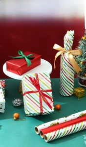 Christmas gift wrapping paper with festive ribbons and colorful patterns for DIY packaging