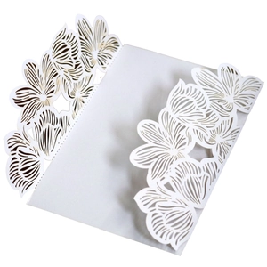 Elegant white laser-cut rose wedding invitation card with intricate hollow floral patterns