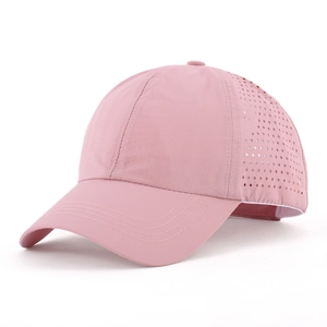 Pink quick-dry baseball cap with laser-cut breathability holes and adjustable strap