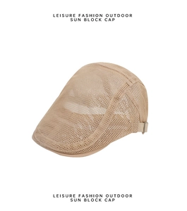 Detail of light khaki mesh flat cap showing breathable fabric and side metal buckle