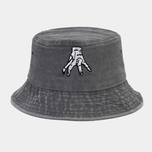 Close-up of vintage washed dark gray bucket hat with hand embroidery and metal eyelets