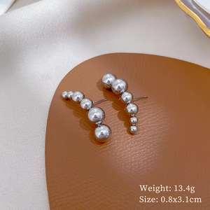 Detailed view of silver titanium steel ball earrings with 0.8x3.1cm size and 13.4g weight