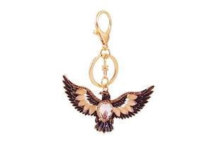 Detailed view of eagle keychain with brown enamel wings and clear crystal rhinestones