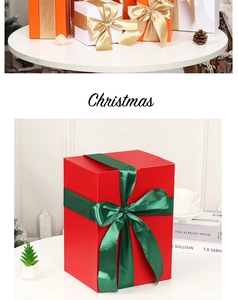 Close-up of decorative Christmas gift boxes with festive ribbons for holiday display