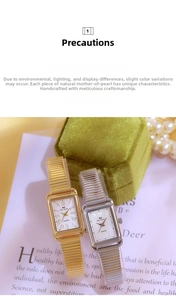 Close-up of vintage square quartz watches with mother-of-pearl dials and elastic bands