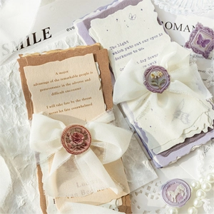 Vintage wax seal stickers with floral art paper and cream lace bow for DIY scrapbooking