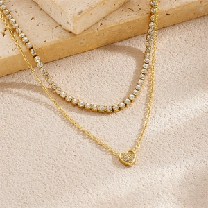 Double-layered gold stainless steel necklace with sparkling crystal heart pendant and tennis chain