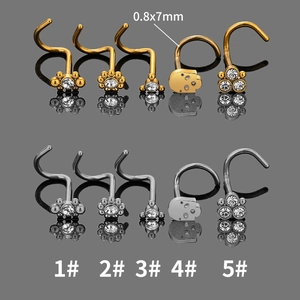 10-piece stainless steel nose stud set with skull and flower designs in gold and silver