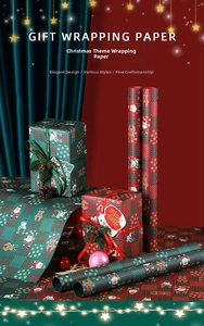 Close-up of waterproof Christmas gift wrapping paper with Santa and reindeer plaid patterns