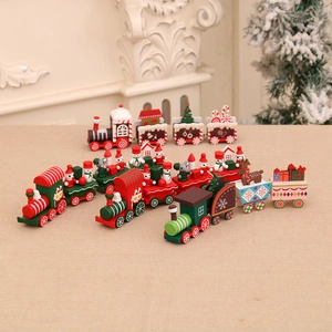 Set of four festive wooden Christmas train ornaments with Santas and snowmen decor