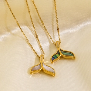 Elegant 14K gold dolphin tail necklace featuring white mother of pearl and zircon details