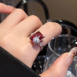 Close-up of luxury rectangular red ruby ring with crown detail and crystal pave setting