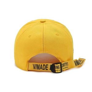 Yellow street style baseball cap featuring a distinctive long VIMADE logo ribbon back strap