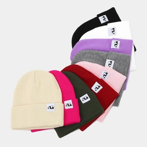 Knitted beanie with panda patch in various colors for winter warmth and comfort