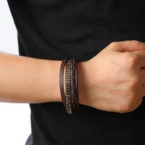 Men's dark brown woven leather bracelet with metal studs and magnetic buckle