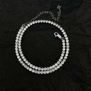 Elegant 925 sterling silver tennis necklace with 4mm round zircons on black background