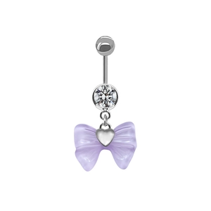 Detailed view of navel ring with light purple bow pendant and heart-shaped metal center
