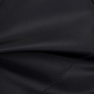 Macro close-up of durable black tactical fabric showing intricate weave and texture