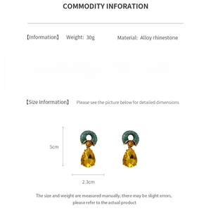 Detailed chart showing size 5cm by 2.3cm and alloy rhinestone material of vintage earrings